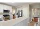 Another view of kitchen featuring stainless steel appliances and white cabinets at 8376 Glen Highlands Dr, Indianapolis, IN 46236