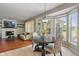 Open floor plan with living room and dining area featuring hardwood floors and natural light at 8376 Glen Highlands Dr, Indianapolis, IN 46236