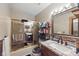Bathroom features a granite countertop and a combined shower and tub at 9130 E 18Th St, Indianapolis, IN 46229