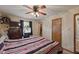 Bright bedroom with ceiling fan, large window and room for relaxing and sleeping at 9130 E 18Th St, Indianapolis, IN 46229