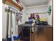 Laundry room featuring washer, dryer and shelving for extra storage and cleaning at 9130 E 18Th St, Indianapolis, IN 46229