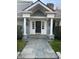 Close-up of the front door showing the columns and black door with sidelights at 9510 Copley Dr, Indianapolis, IN 46260