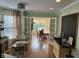 Cozy living area featuring hardwood floors, a chalkboard, and French doors that open to a dining area at 9510 Copley Dr, Indianapolis, IN 46260