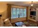 Living room with bay window, built-in shelves, and comfortable seating at 9510 Copley Dr, Indianapolis, IN 46260