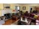 Bright and airy living room featuring a fireplace, hardwood floors and comfortable seating at 9510 Copley Dr, Indianapolis, IN 46260