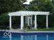 Elegant poolside pergola with seating, offering a perfect outdoor retreat at 9510 Copley Dr, Indianapolis, IN 46260
