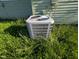 Home's air conditioning unit surrounded by green grass at 9712 N Price St, Knightsville, IN 47857