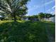 Expansive backyard with lush greenery surrounding a charming home and detached buildings at 9712 N Price St, Knightsville, IN 47857