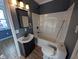 Bathroom features a black vanity, white shower/tub combo, and a modern faucet at 9712 N Price St, Knightsville, IN 47857