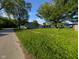 Landscaped yard surrounds a charming house on a corner lot, offering a spacious outdoor area at 9712 N Price St, Knightsville, IN 47857