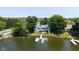 Beautiful waterfront property with private boat dock, lush landscaping, and well-maintained surroundings at 101 Edgewater Dr, Noblesville, IN 46062
