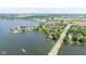 Scenic aerial view of a lakeside neighborhood with homes, docks, and a convenient bridge at 101 Edgewater Dr, Noblesville, IN 46062
