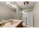 This bathroom features a shower with glass doors and a sink with ample counter space at 101 Edgewater Dr, Noblesville, IN 46062