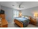 Cozy bedroom features neutral walls, a ceiling fan, and natural light from the window at 101 Edgewater Dr, Noblesville, IN 46062