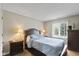 Serene bedroom with a queen-size bed, matching nightstands, and a bright window at 101 Edgewater Dr, Noblesville, IN 46062