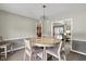 Dining room with a round table and view into the kitchen and living room areas at 101 Edgewater Dr, Noblesville, IN 46062