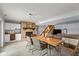 Basement dining area showcasing a brick fireplace, wet bar, and nearby stairs at 101 Edgewater Dr, Noblesville, IN 46062