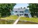 Scenic waterfront home with a well-kept lawn, direct lake access via private dock, and an inviting exterior at 101 Edgewater Dr, Noblesville, IN 46062