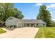 Attractive single-story home with a large driveway, well-maintained lawn, and inviting curb appeal at 101 Edgewater Dr, Noblesville, IN 46062