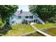 Charming lakefront home featuring a lush lawn, private dock access, and an inviting exterior aesthetic at 101 Edgewater Dr, Noblesville, IN 46062