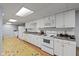 Efficient kitchen with white appliances, ample cabinetry, and durable countertops at 101 Edgewater Dr, Noblesville, IN 46062