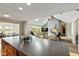 Open concept living room showcasing a fireplace, high ceiling and skylights at 101 Edgewater Dr, Noblesville, IN 46062