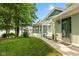 Charming home exterior with a pergola, lush lawn and tranquil waterfront views at 101 Edgewater Dr, Noblesville, IN 46062