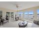 Inviting sunroom with lake views, comfortable seating, and access to the outdoors at 101 Edgewater Dr, Noblesville, IN 46062