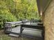 Outdoor deck space perfect for entertaining or relaxing with wooded backdrop at 10328 Central Ave, Carmel, IN 46280