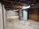 Unfinished basement with visible utilities and block foundation at 10328 Central Ave, Carmel, IN 46280