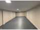 Spacious basement with painted block walls and ceiling lights at 10328 Central Ave, Carmel, IN 46280