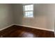 Bedroom featuring hardwood floors, neutral paint, and one window at 10328 Central Ave, Carmel, IN 46280