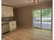Eat-in kitchen featuring stainless appliances, a gray backsplash, and sliding glass doors to the back porch at 10328 Central Ave, Carmel, IN 46280