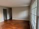 Spacious living room with hardwood floors and plenty of natural light from large windows at 10328 Central Ave, Carmel, IN 46280