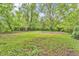 Expansive backyard with lush greenery, mature trees, and a grassy open area at 10346 Wilson Rd, Brownsburg, IN 46112