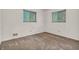 Empty bedroom featuring neutral walls, carpet flooring, and natural light from two windows at 10346 Wilson Rd, Brownsburg, IN 46112
