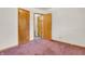 Bedroom featuring neutral walls, carpet flooring, an open doorway and an additional doorway at 10346 Wilson Rd, Brownsburg, IN 46112