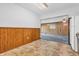 Dining area featuring wood-paneled walls and tile floor at 10346 Wilson Rd, Brownsburg, IN 46112