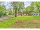 Charming single-story home with a brick facade and a lush green front yard at 10346 Wilson Rd, Brownsburg, IN 46112
