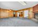 The main living area includes classic wood paneling and a brick fireplace at 10346 Wilson Rd, Brownsburg, IN 46112