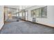 Carpeted living room with a mirrored wall that reflects light and amplifies the sense of space at 10346 Wilson Rd, Brownsburg, IN 46112