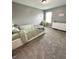 Bedroom featuring a neutral wall color, carpet floors, and a window that allows natural light to enter the room at 10847 Woodlook Ln, Indianapolis, IN 46239