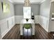 Bright dining room features modern table and chairs, contemporary lighting, and stylish decor at 10847 Woodlook Ln, Indianapolis, IN 46239