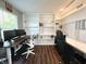 Home office featuring built-in shelves, a spacious desk, and ample room for work and study at 10847 Woodlook Ln, Indianapolis, IN 46239