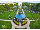 Vibrant aerial view of a town square with a gazebo and people enjoying the outdoor space at 12860 University Cres # 1B, Carmel, IN 46032
