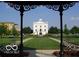 View of town hall from gazebo, showcasing well-manicured lawns and pedestrian friendly walkways at 12860 University Cres # 1B, Carmel, IN 46032