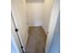 Spacious walk-in closet with neutral carpet and built-in shelving for organized storage at 12860 University Cres # 1B, Carmel, IN 46032