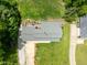 Aerial view reveals lush greenery surrounding home; deck, lawn, driveway at 12920 N Oakhaven Dr, Camby, IN 46113