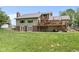 Expansive backyard features a two-story house with deck and patio, perfect for outdoor living and entertaining at 12920 N Oakhaven Dr, Camby, IN 46113