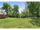Backyard featuring an expansive lawn with mature trees and privacy, offering a serene outdoor retreat at 12920 N Oakhaven Dr, Camby, IN 46113
